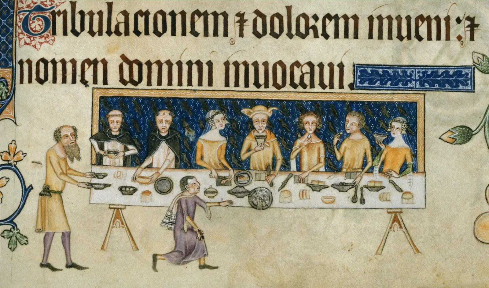 Sir Geoffrey Luttrell sitzt mit Frauen, Geistlichen und weiteren Personen an einer gedeckten Tafel, während Diener Speisen und einen Becher bringen