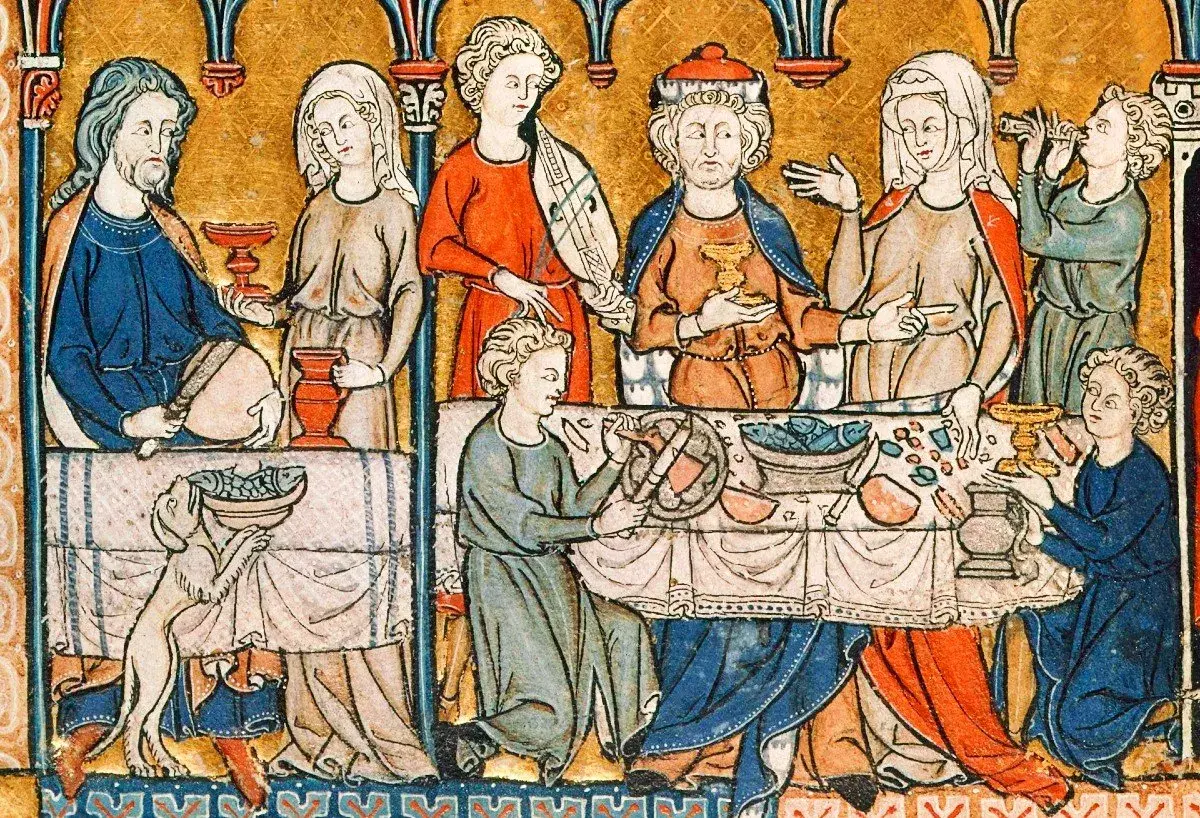 Buchmalerei eines mittelalterlichen Festmahls mit Speisen, Gefäßen und mehreren Personen